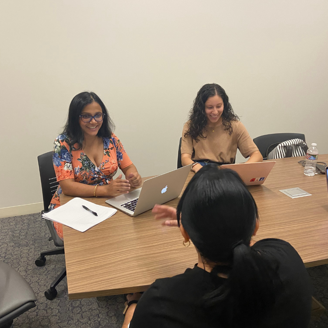 Clinic students, Narmada Sapkota and Stephanie Melgar Garcia, preparing an asylum seeker for her merits hearing.
